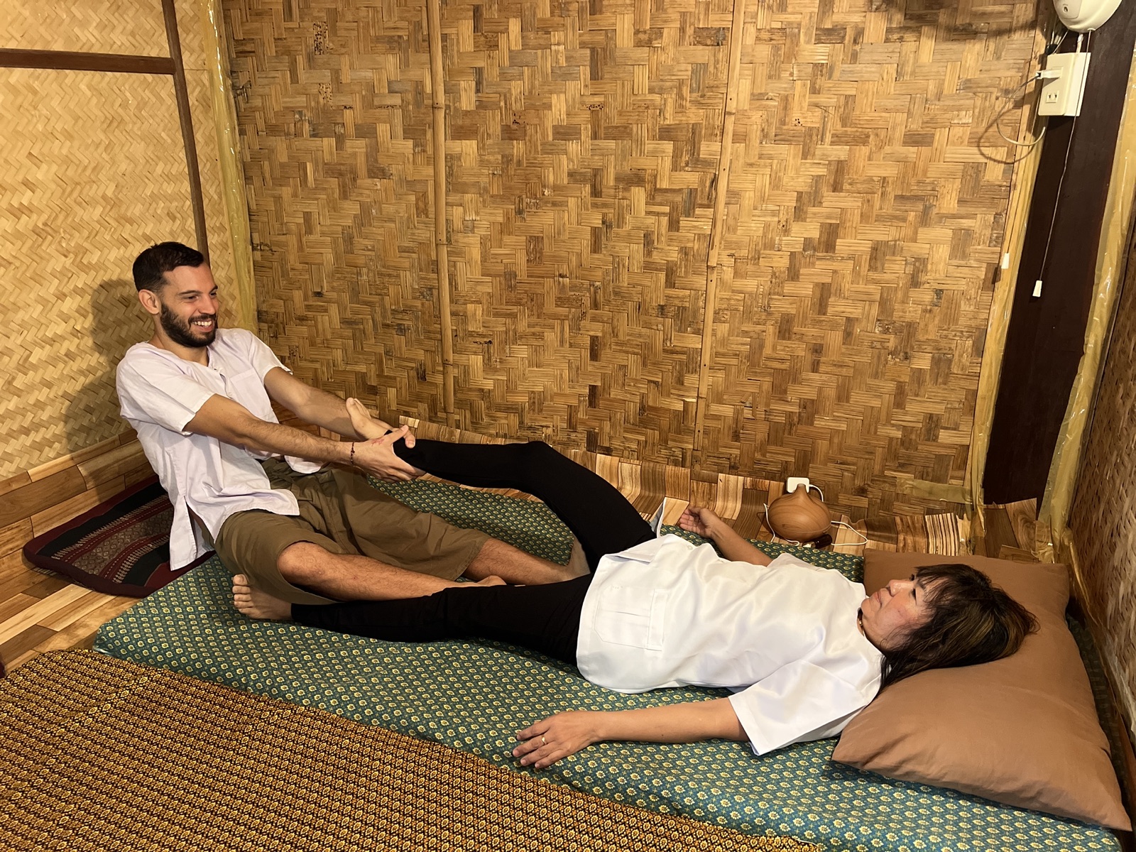 Practising Thai massage with teacher Pi Joy