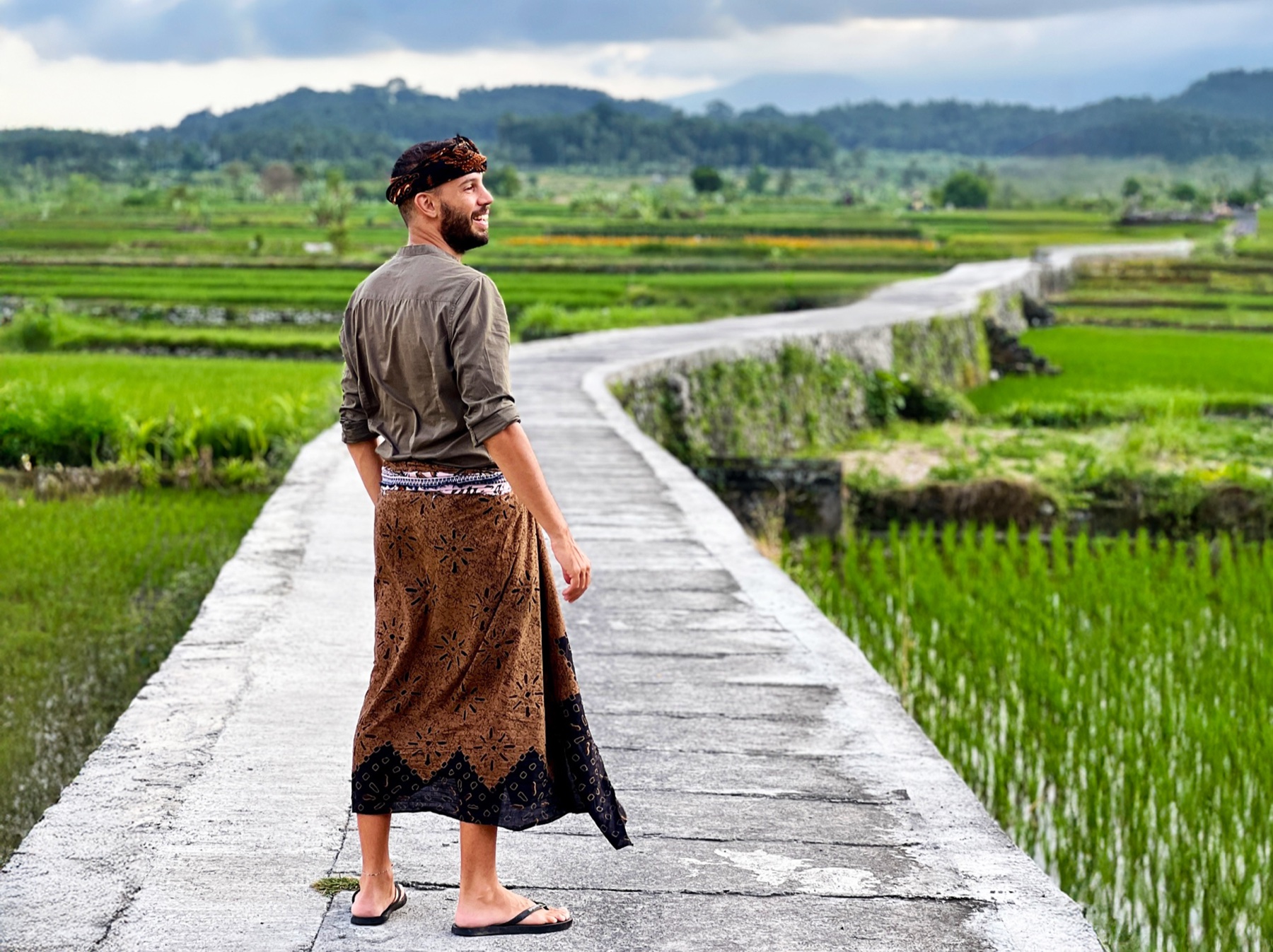Filippo dressed in traditional Balinese attire in the rice fields