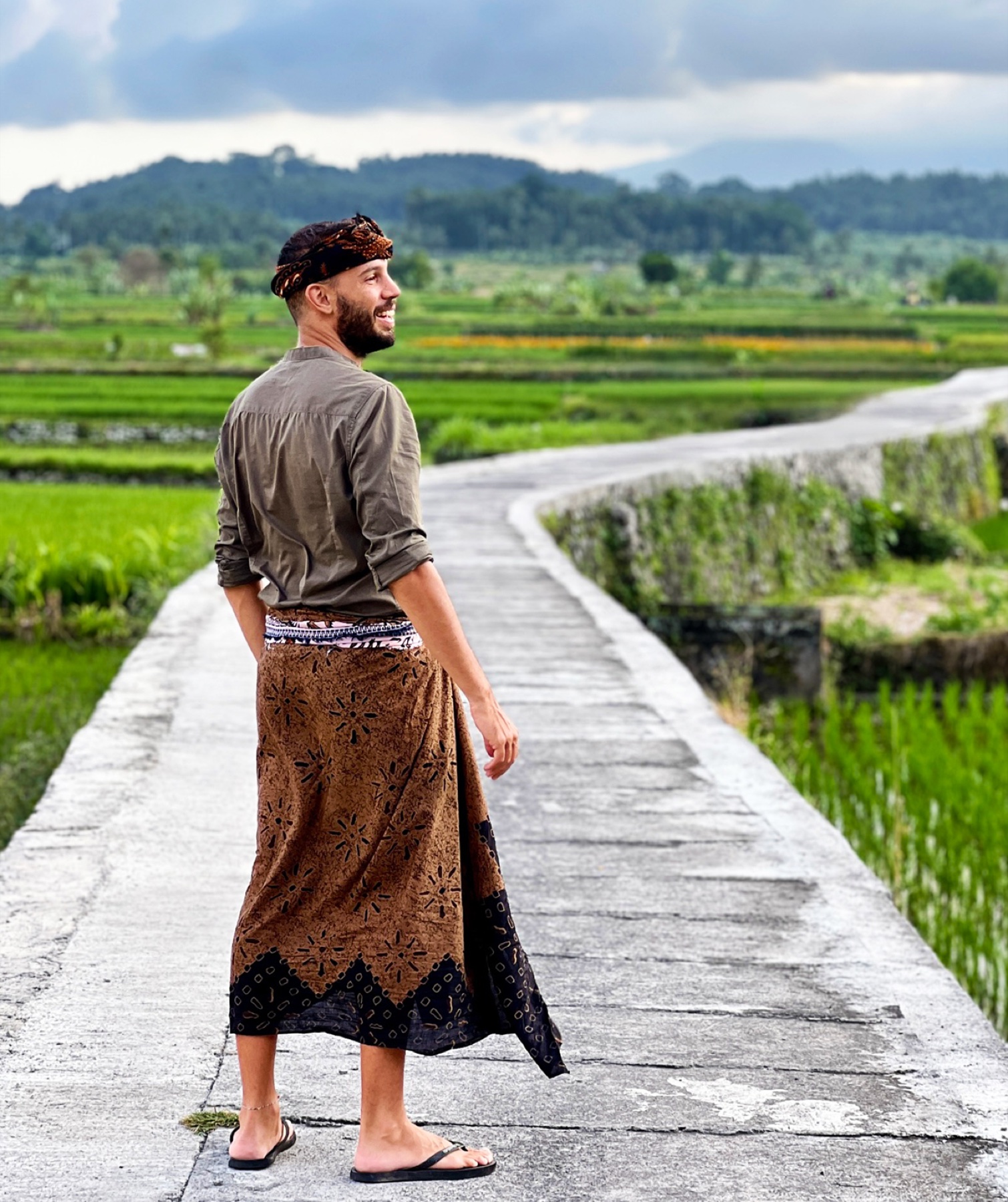 Filippo dressed in traditional Balinese attire in the rice fields